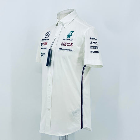 White short-sleeve team shirt angled view with button front, Petronas INEOS logo and navy trim