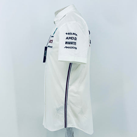 White team shirt sleeve side close-up with SOLERA, AMDA, PIRELLI, AKKODi logos and navy trim