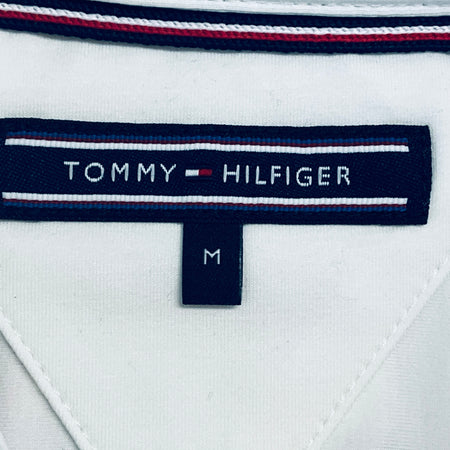 Tommy Hilfiger neck label with red-white-blue striped trim on white team shirt
