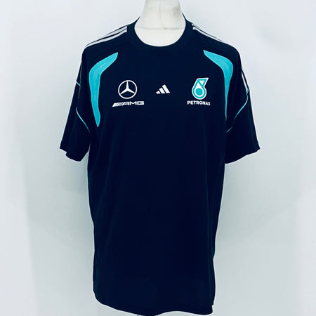 Navy Mercedes-AMG Petronas F1 team t-shirt with teal emblem and white sponsor logos.