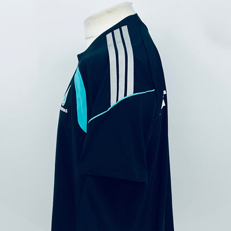 Navy F1 team t-shirt with white sleeve stripes and teal accent on the shoulder.