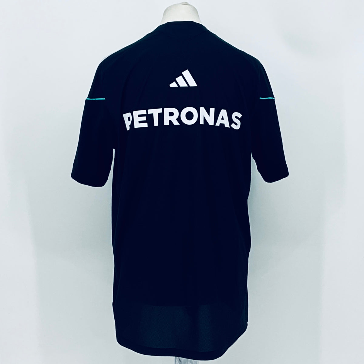 Navy F1 team t-shirt back with large PETRONAS text and adidas logo above.