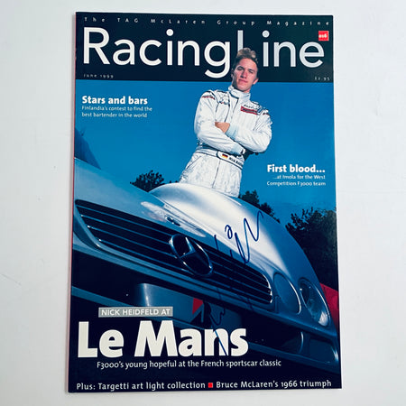 Racing magazine with photo of a driver and blue race car cover