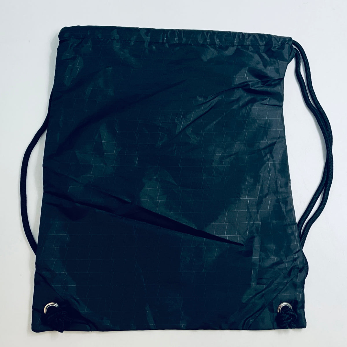 Dark drawstring bag with diagonal graphics and dual draw cords