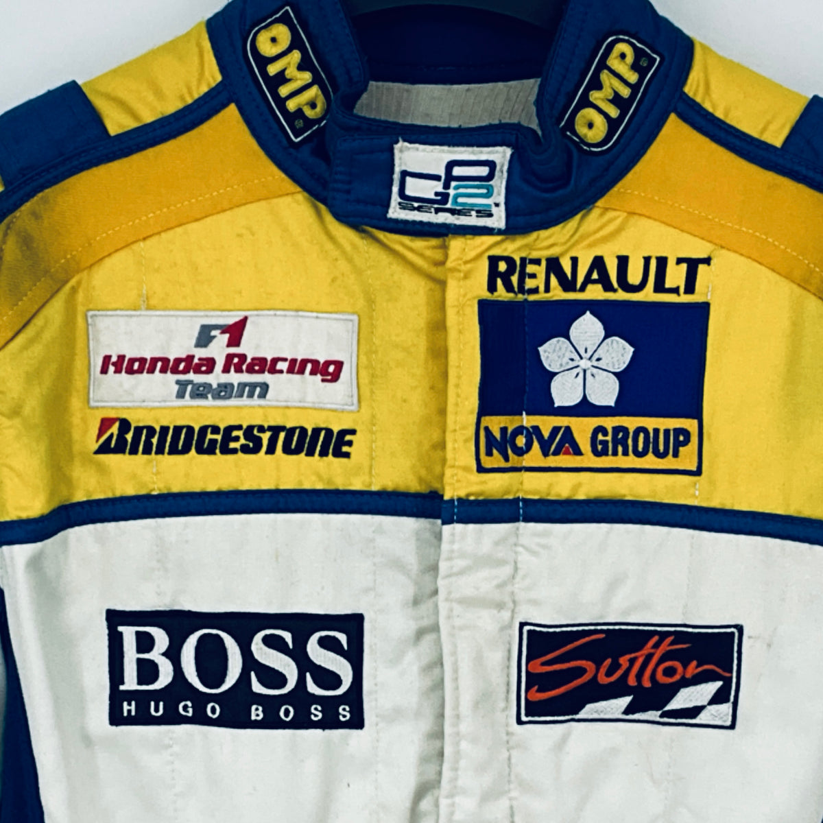 Race driver suit collar and chest logos, yellow and white with blue trim