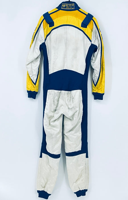 Back of race driver suit with yellow and blue shoulders and white paneling