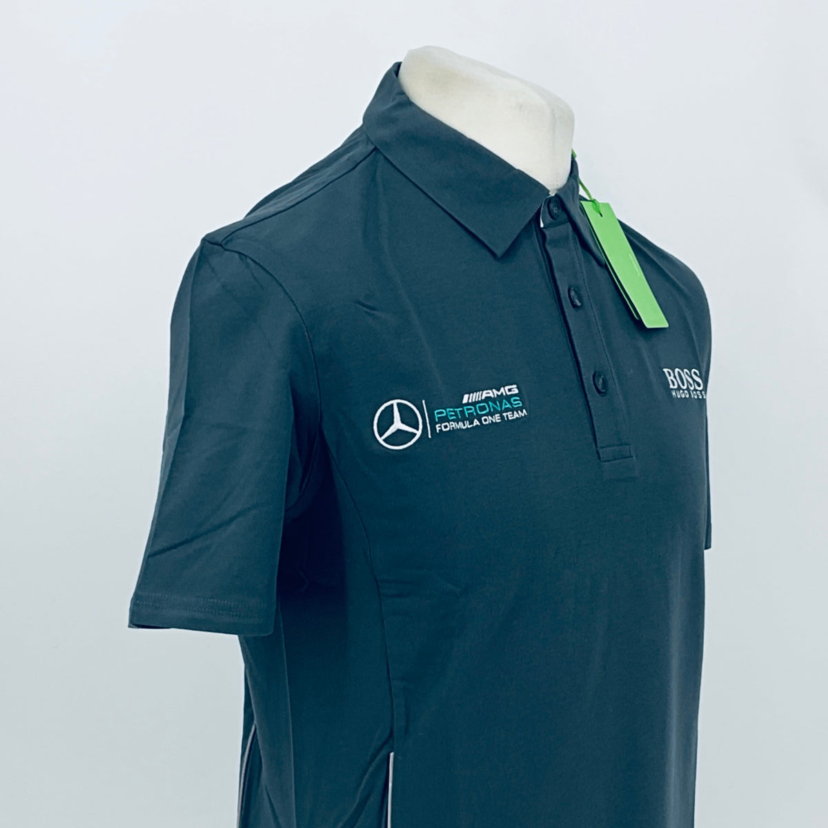 Boss polo shirt in dark teal, front side view with left chest racing logo
