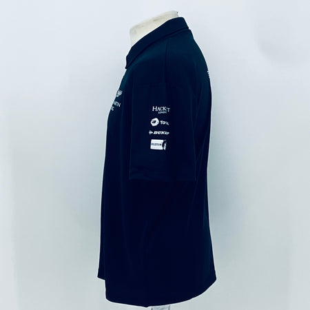 Navy Aston Martin Racing polo shirt with small sponsor logos on sleeve and back.