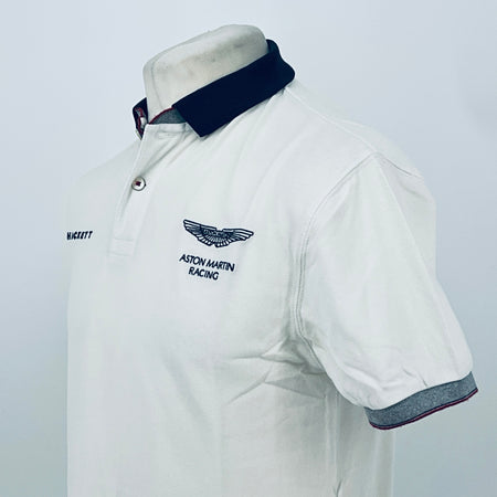 White polo shirt with navy collar and Aston Martin Racing chest logo, side angle