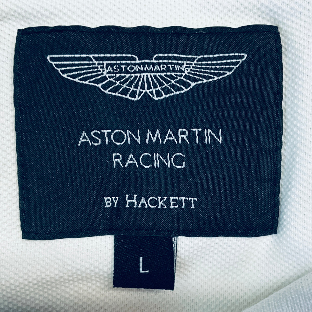 Navy and white size L clothing label: Aston Martin Racing by Hackett