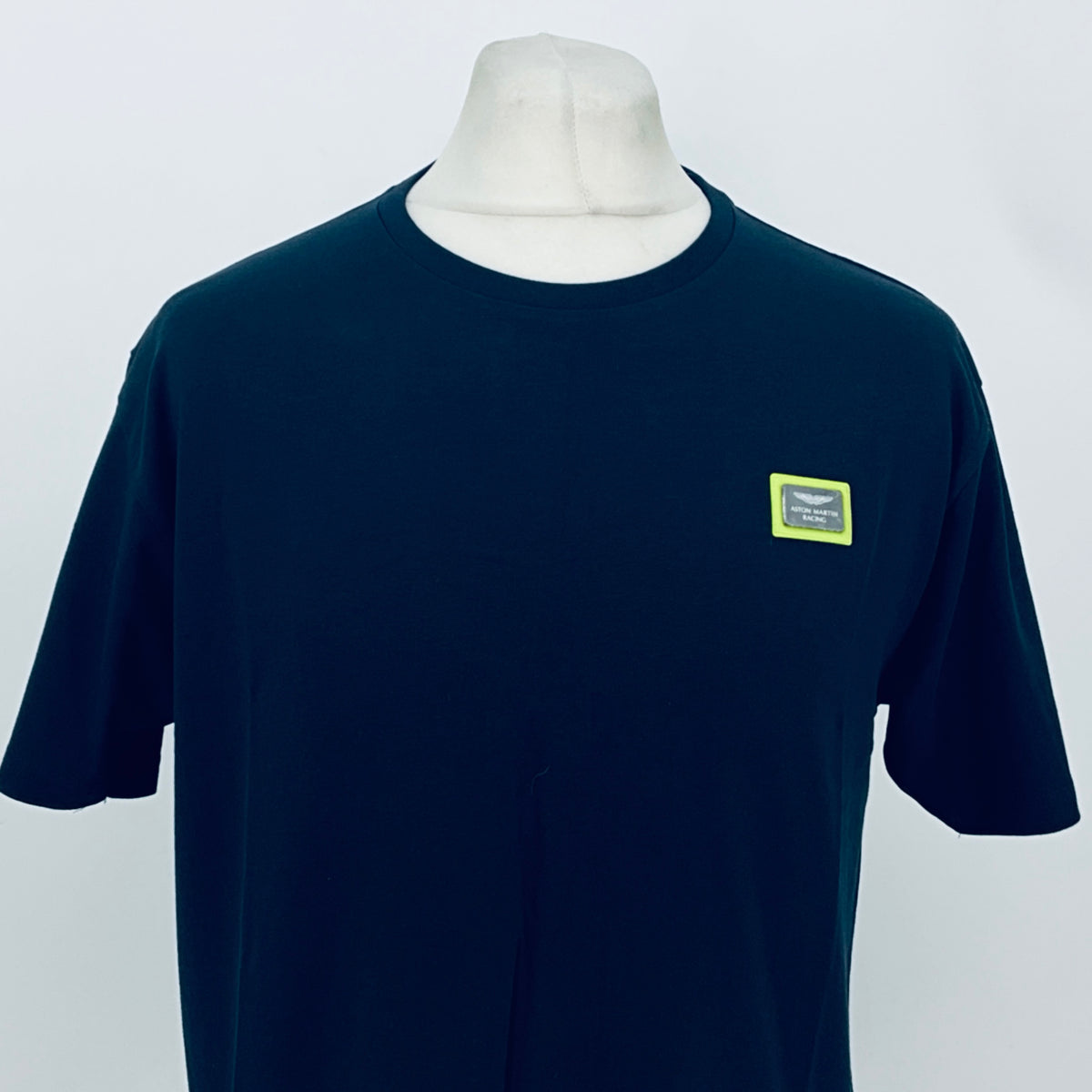 Navy short-sleeve T-shirt with chest patch logo on the right