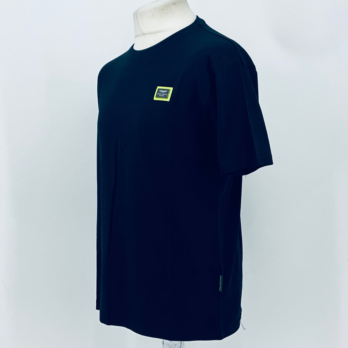 Navy short-sleeve T-shirt, side view, small chest patch logo