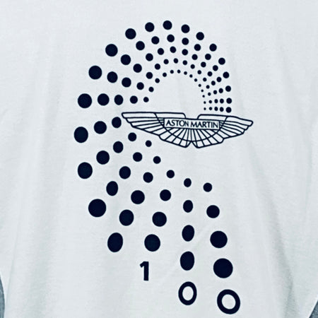 Close-up of dotted Aston Martin wing logo on back of white polo shirt