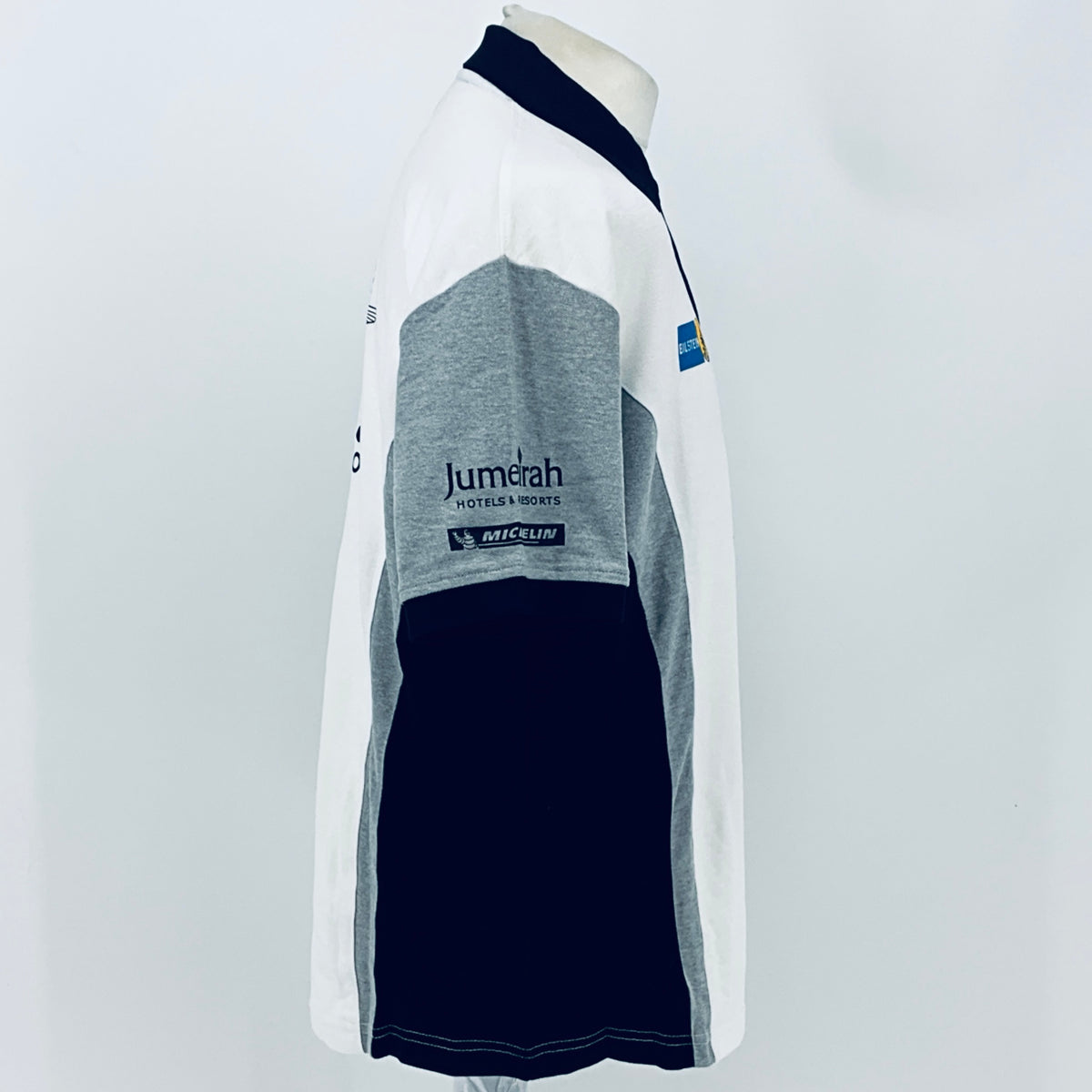 White and gray racing team polo shirt with navy collar and sleeve panels