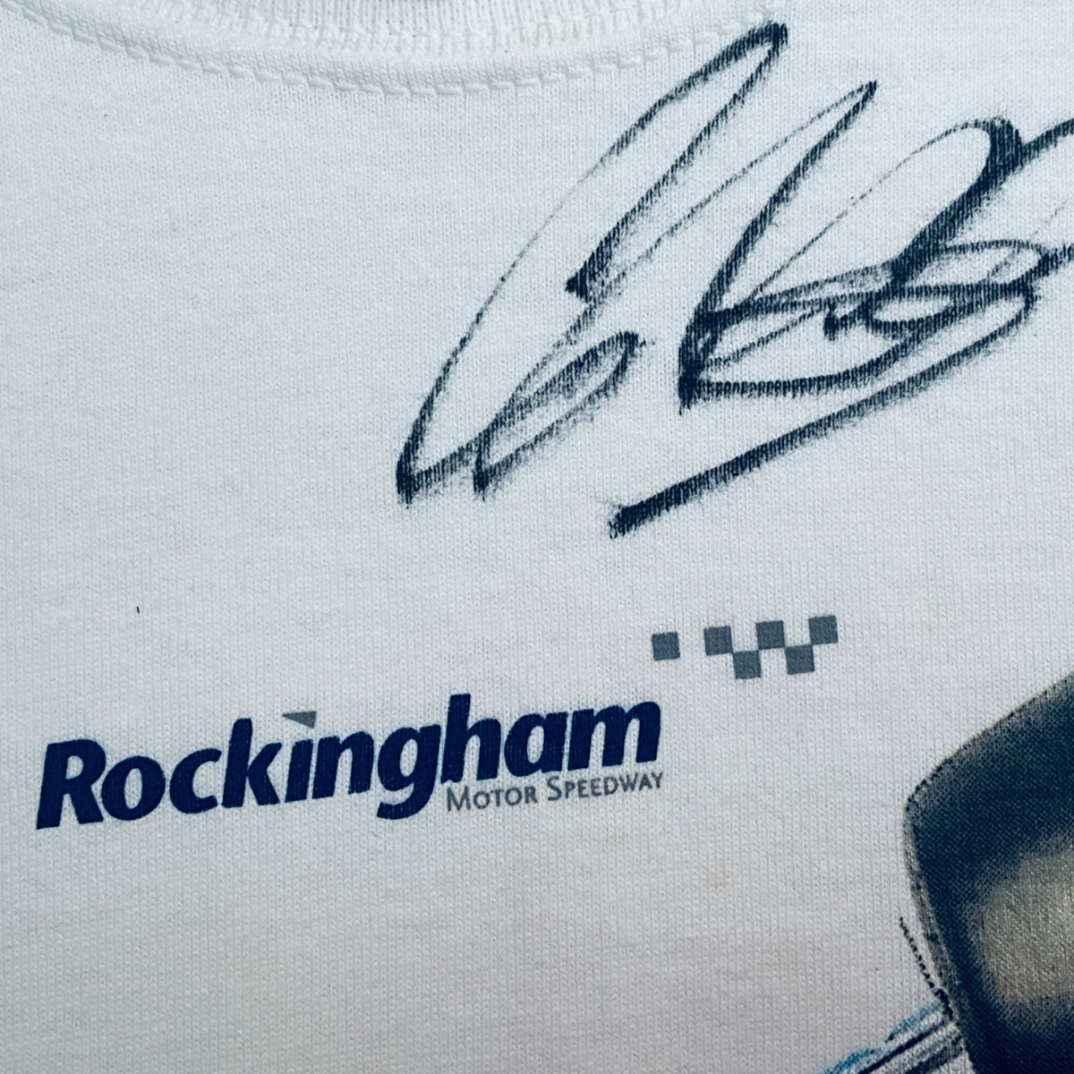 White T-shirt detail: Rockingham Motor Speedway logo and checkered mark