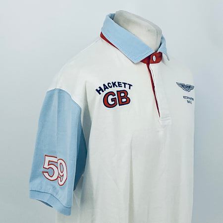 White polo shirt with light blue sleeves, HACKETT GB logo, and red button placket