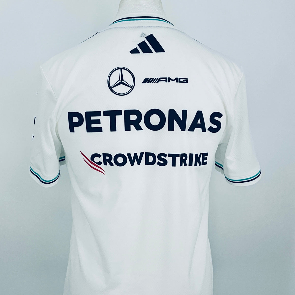 White team driver t-shirt, close back view with PETRONAS, CROWDSSTRIKE, and logos