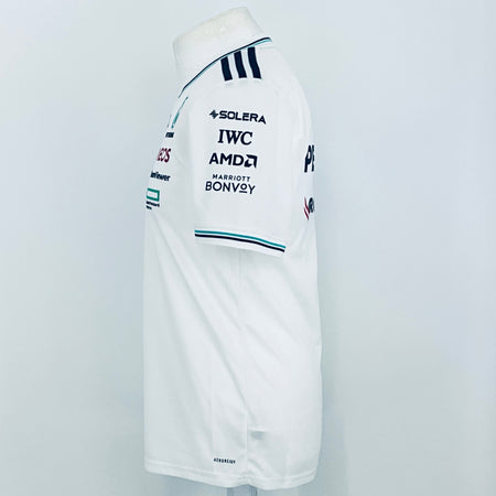 White team driver t-shirt sleeve with SOLERA, IWC, AMD, and BONVOY sponsor prints