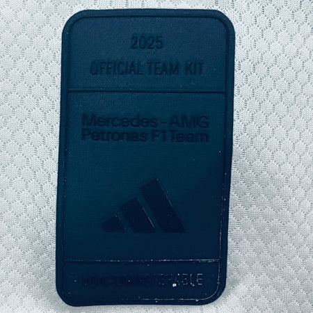 Dark blue woven patch label with embossed 2025 official team kit text