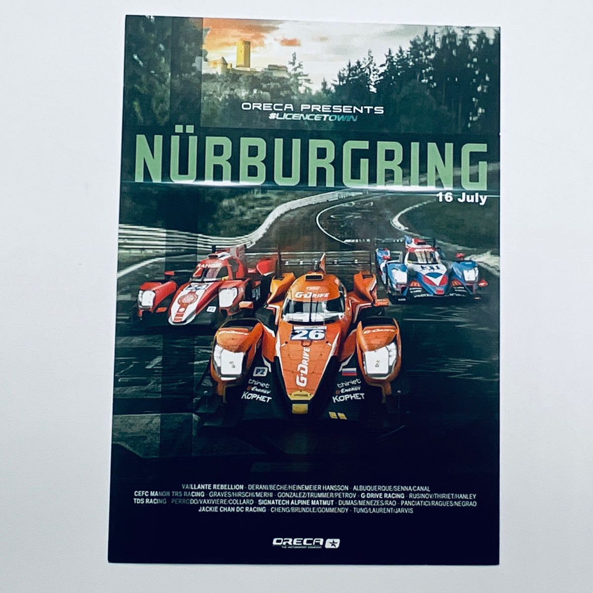 Promotional poster for a race event at Nörburgring with racing cars and event details.