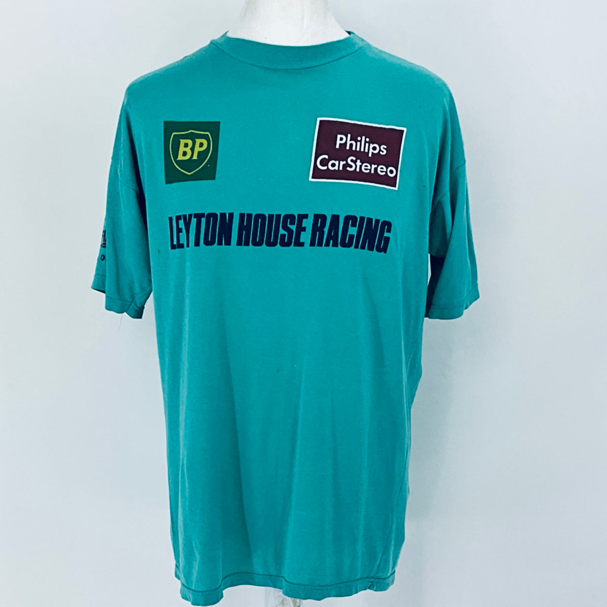 Teal t-shirt with 'Leyton House Racing' text and logos on a white background