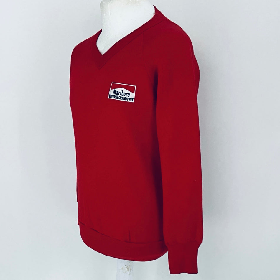 Red sweatshirt with a logo on a white background