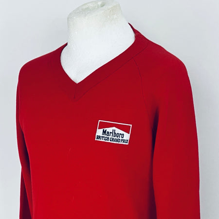 Red sweatshirt with a Marlboro logo on a mannequin against a white background
