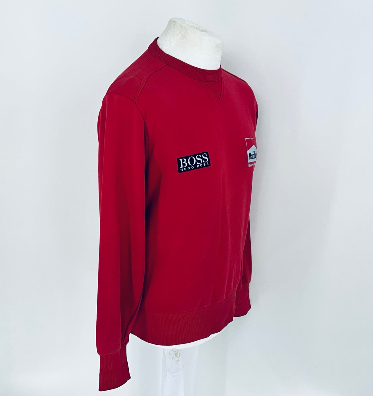 Red sweatshirt with a logo on a white background